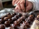 Team Building Cooking Class - DIY Chocolates With Your Crew - NYC in Manhattan: decorating chocolate by using paintbrush