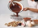Cooking Class - Make Dubai Style Chocolate Bars in East Bay: pouring tempered chocolate into bar shapes