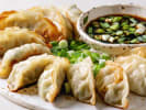Team Building Cooking Class - Team Dumpling Showdown: plated potsticker dumplings with soy sauce and scallions (2)