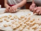 Team Building Cooking Class - The Great Dumpling Competition: a pair of people folding dumplings