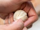 Cooking Class - Fold, Fill and Cook Dumplings in Boston Proper: filling dumplings by hand