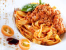 Cooking Class - Make Fresh Pasta & Bolognese in Downtown Dallas: refined plate of Bolognese pasta