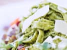 Cooking Class - Fun Pasta Making at a Local Wine Bar in Atlanta: pasta with pesto sauce and Parmesan cheese garnish up close