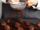 Cooking Class - Handcrafted Chocolate Truffles in Atlanta: dusting chocolate truffles with cacao
