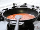 Cooking Class - Handmade Fettuccine and Marinara in Charlotte: simmering tomato sauce in a pan