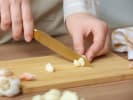 Cooking Class - Make Fettuccine With Creamy Alfredo in East Bay: cutting garlic