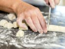 Cooking Class - Tomato Basil Gnocchi From Scratch in Orlando: cutting gnocchi into smaller pieces