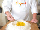 Cooking Class - Create Your Own Pasta in Orlando: making fettuccine pasta with flour and eggs in Cozymeal expert chef apron