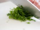 Cooking Class - International Culinary Creations in Austin: chopping herbs