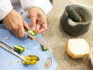 Cooking Class - Savor the Diversity of Delhi in Austin: chopping jalapenos
