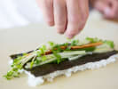 Cooking Class - Learn to Make Sushi by Hand in Raleigh: closeup of chef making vegetarian sushi roll
