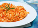 Cooking Class - Linguine With a Kick in Houston: Linguine pasta soaked in tomato sauce on a plate
