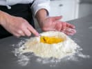 Cooking Class - Linguine With a Kick in Houston: Chef making linguine pasta pasta dough with flour and eggs