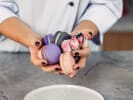 Cooking Class - Macaron Decorating for Beginners in Atlanta: holding colorfully painted macarons