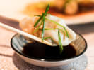 Cooking Class - Make Fresh Dumplings in Alexandria: dipping gyoza dumpling in a soy sauce