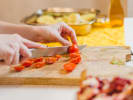 Cooking Class - Fundamentals of Homemade Pasta in Columbus, OH: slicing tomatoes