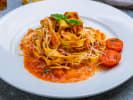Cooking Class - Fresh Pasta and Marinara Mastery in Orlando: tomato sauce coated fettuccine pasta on a plate