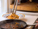 Cooking Class - Fresh Pasta and Marinara Mastery in Orlando: plating fresh fettuccine pasta coated in marinara sauce