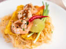 Cooking Class - Make Shrimp Pad Thai in Baltimore: pad thai top view on a white plate with slices of lime on the side