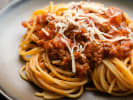 Cooking Class - Master Fresh Pasta & Bolognese in Washington, D.C.: spaghetti bolognese pasta on a dark plate