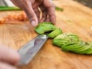 Cooking Class - Sushi Rolling Made Easy in Denver: precise knife skills when cutting avocado