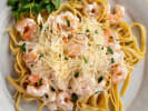 Team Building Cooking Class - Group Pasta Workshop: pasta alfredo topped with cheese and shrimp