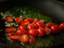 Cooking Class - Pasta From Scratch in Charlotte: cooking fresh tomatoes with a bit of garlic in a pan for sauce making