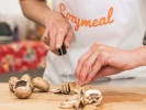 Cooking Class - Ravioli Two Ways in Houston: cutting mushrooms