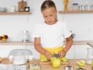 Cooking Class - Summer Camp for Young Chefs in Buckhead: a young girl slicing apples