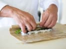 Cooking Class - Authentic Japanese Sushi in Orlando: chef rolling sushi with vegetables