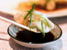 Cooking Class - Traditional Handmade Dumplings in Columbus, OH: pouring dumplings into soy sauce