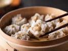 Cooking Class - Traditional Handmade Dumplings in Columbus, OH: grabbing shumai dumplings with sticks