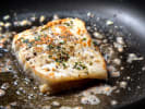 Culinary Adventure - A Fiery Fusion Experience in DC: cooking halibut