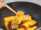 Cooking Class - Cook Authentic Pad Thai in Minneapolis: cooking tofu in a wok pan