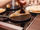Cooking Class - Parisian Plates and Recipes in Westchester, NY: chef cooking thin crÃªpes in pan