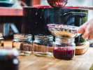 Cooking Class - Make a Cozy Easter Feast in Downtown Dallas: cooking fresh chutney and straining it into a jar
