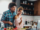 Online Cooking Class - Indian-Chinese Fusion in Downtown Toronto: couple taking an online cooking class at home