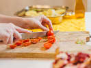 Cooking Class - Make Pasta at a Local Distillery in Downtown Chicago: cutting cherrie tomatoes