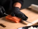 Cooking Class - Handmade Sushi and Dumplings: cutting fresh salmon