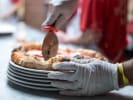 Team Building Cooking Class - Stretch & Top Your Neapolitan Pizza Together in Manhattan: cutting handmade pizza