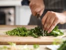 Cooking Class - International Holiday Cooking in Downtown Dallas: cutting parsley