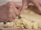 Cooking Class - Spirit of Italy in Manhattan: cutting pieces of Parmesan