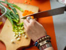 Cooking Class - Make Flaky Scallion Pancakes From Scratch in Boston Proper: cutting scallions on a wooden board