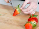 Team Building Cooking Class - Charcuterie Board Team Challenge in San Francisco: cutting strawberries