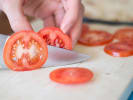 Team Building - Connecting Over Classic French Fare in Denver: cutting tomato