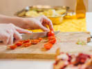 Cooking Class - Craft Tagliatelle From Scratch in Austin: cutting tomatoes