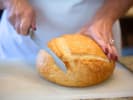 Cooking Class - Exploring Everyday Breads in Northern Suburbs: cutting fresh bread