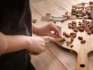 Cooking Class - Learn Cozy Baking Favorites in Downtown Dallas: cutting pecans