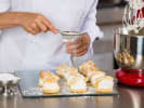 Cooking Class - French Pastry Made Simple: dusting cream puff profiteroles with icing sugar