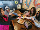 Food Tour + Drink Upgrade - Best Eats and Drinks in East Nashville in Nashville: a group enjoying food tour in nashville